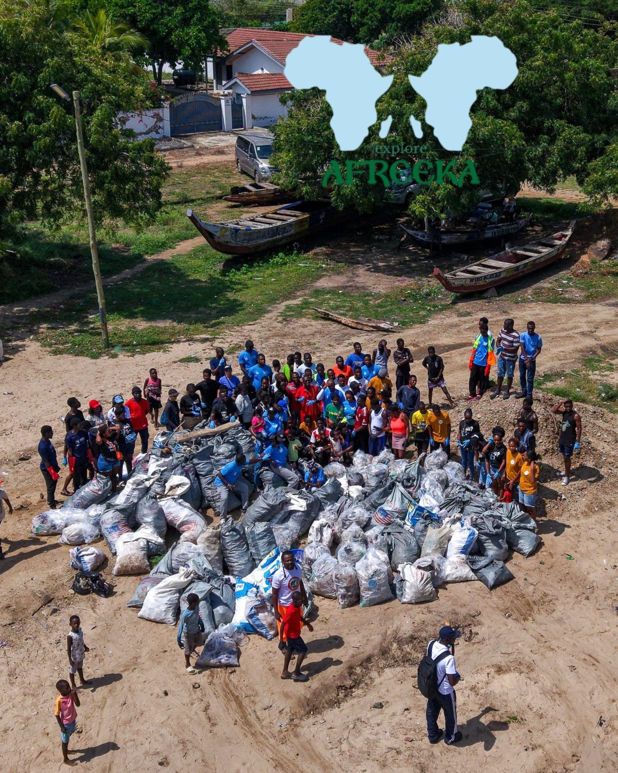 Community members with bags collected during a Prampram beach clean-up